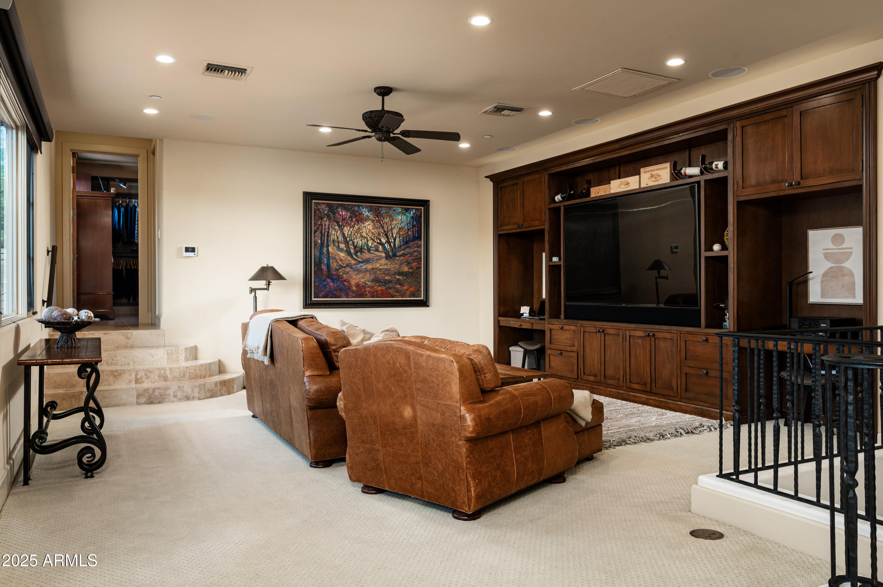 20263 North 102nd Place Scottsdale, AZ 85255 - Photo 25 of 58 a living room with furniture and a flat screen tv