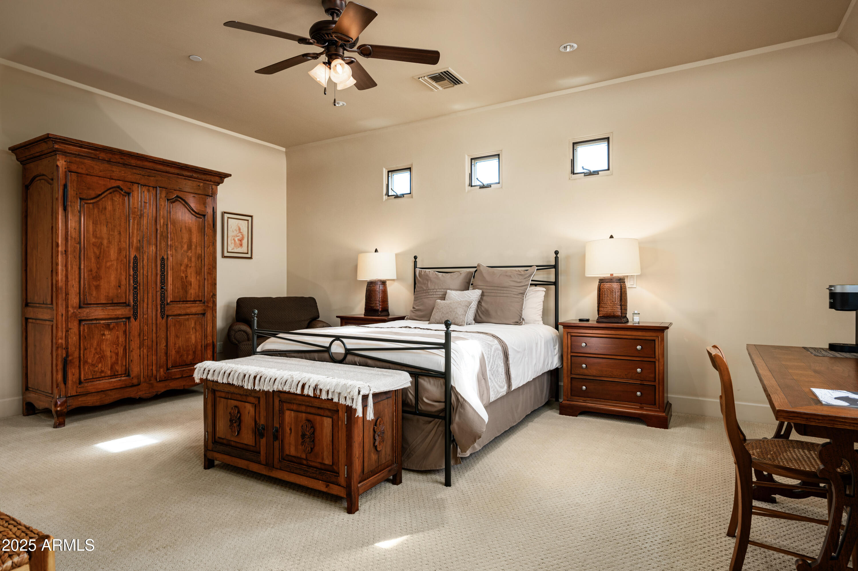 20263 North 102nd Place Scottsdale, AZ 85255 - Photo 29 of 58 a bedroom with a bed and cabinets