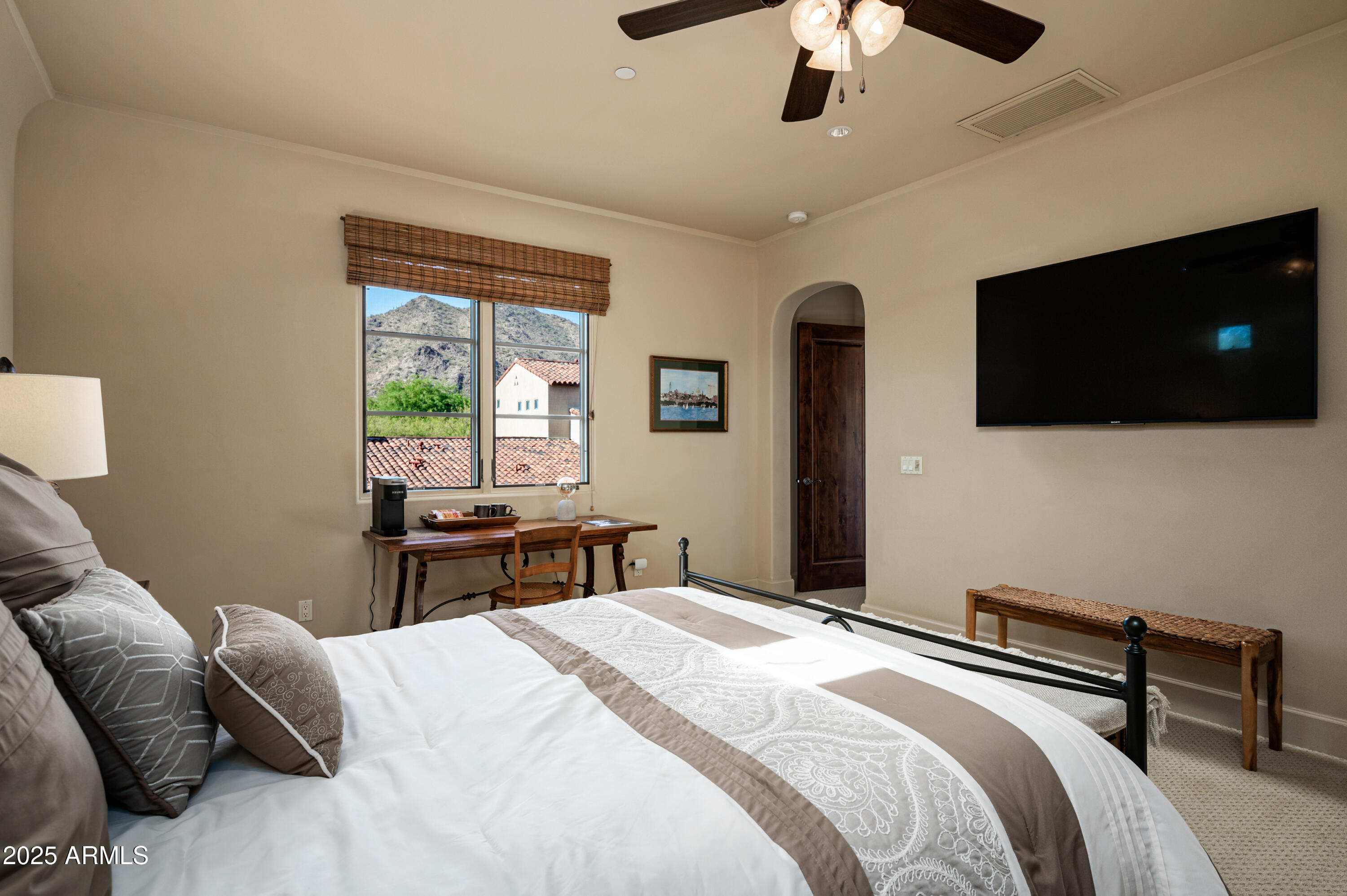 20263 North 102nd Place Scottsdale, AZ 85255 - Photo 30 of 58 a bedroom with a bed and a flat screen tv