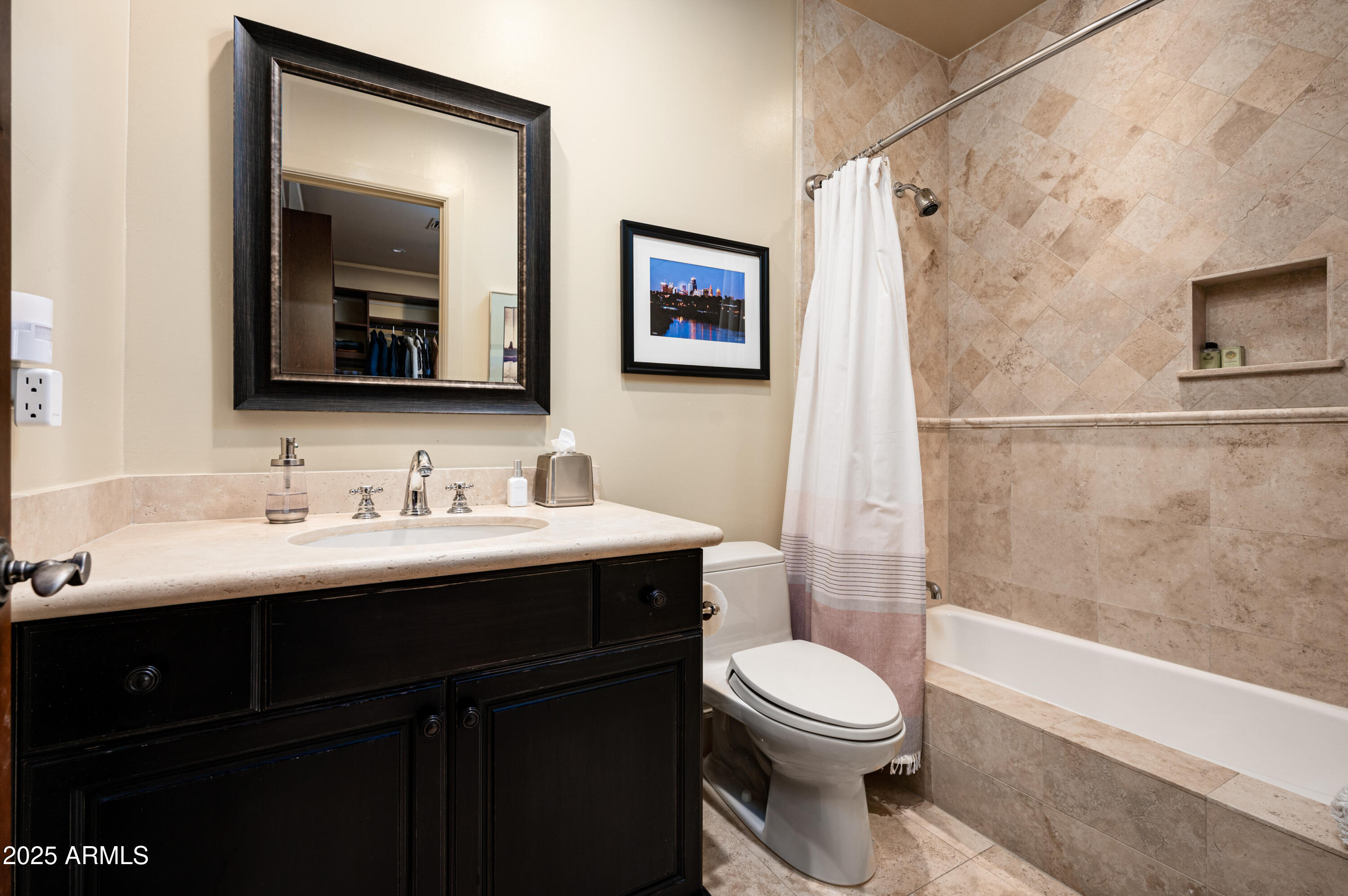 20263 North 102nd Place Scottsdale, AZ 85255 - Photo 33 of 58 a bathroom with a toilet a sink and mirror