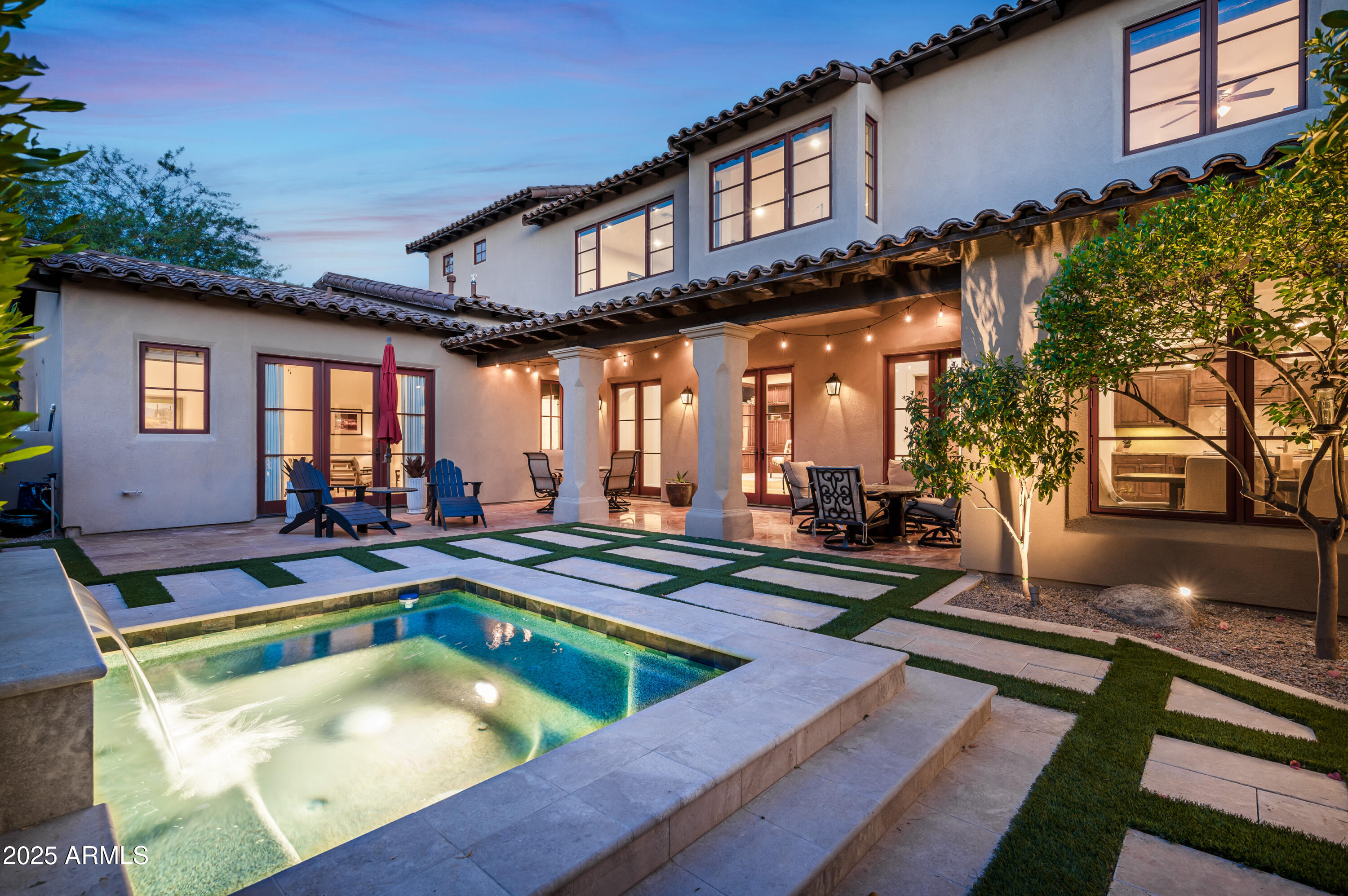20263 North 102nd Place Scottsdale, AZ 85255 - Photo 37 of 58 a view of a house with pool and chairs