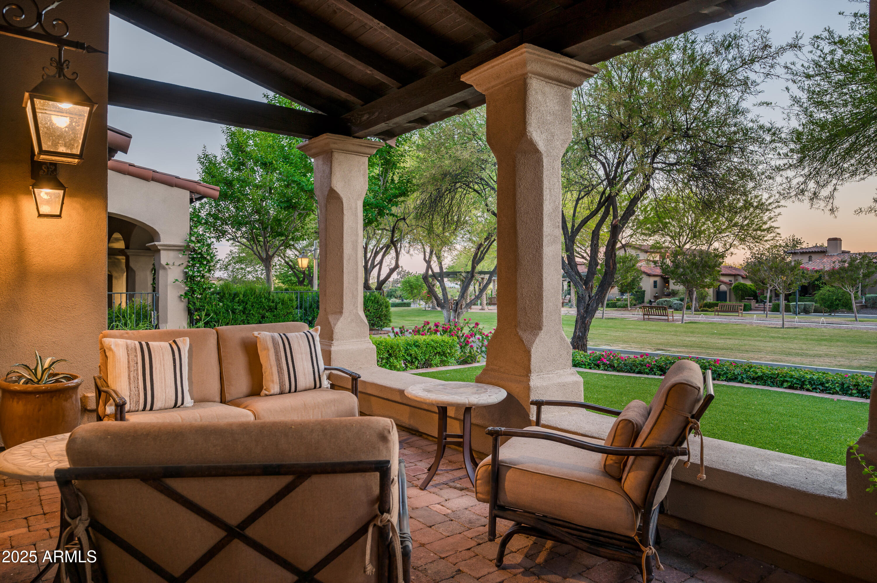 20263 North 102nd Place Scottsdale, AZ 85255 - Photo 41 of 58 a view of a patio with lawn chairs next to a yard