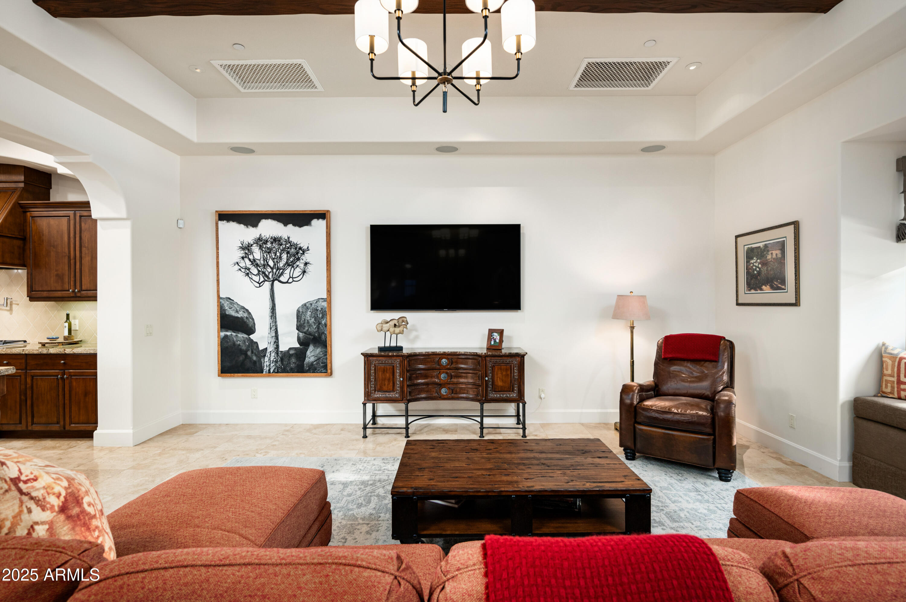 20263 North 102nd Place Scottsdale, AZ 85255 - Photo 9 of 58 a living room with furniture and a flat screen tv