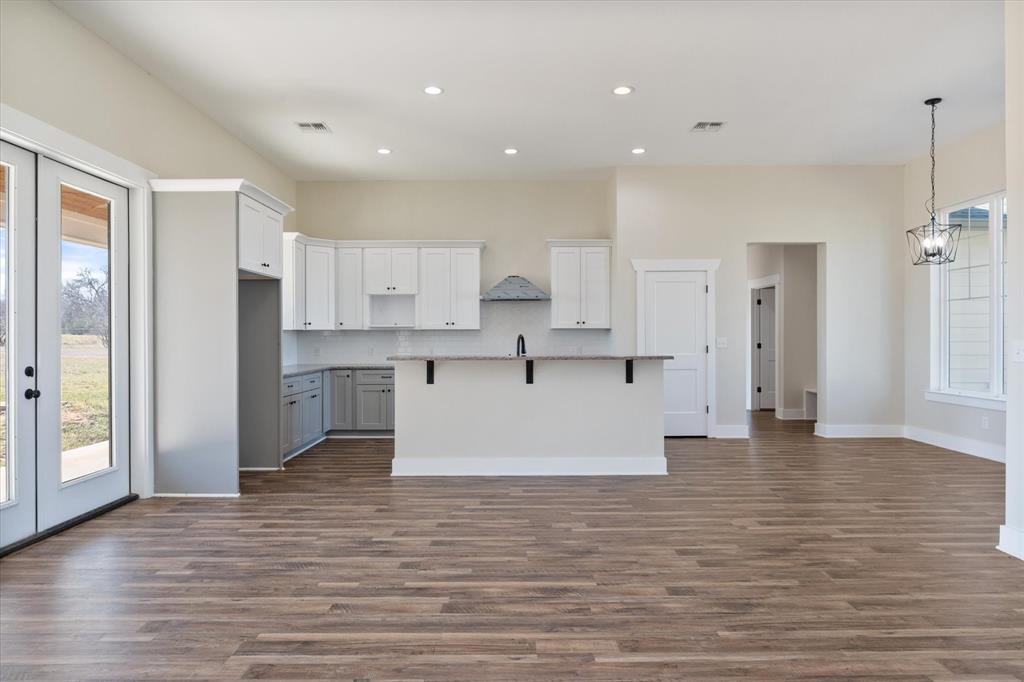 4003 Nettle Road Streetman, TX 75859 - Photo 16 of 33 a view of kitchen with wooden floor and electronic appliances