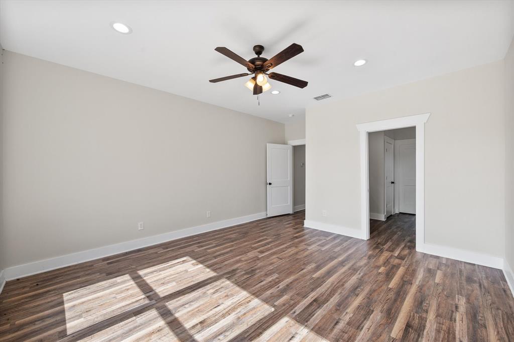 4003 Nettle Road Streetman, TX 75859 - Photo 19 of 33 a view of a livingroom with a ceiling fan and wooden floor