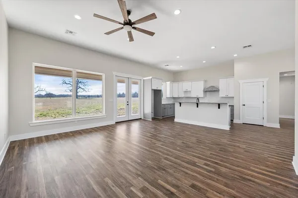 a view of a kitchen with a sink and a window