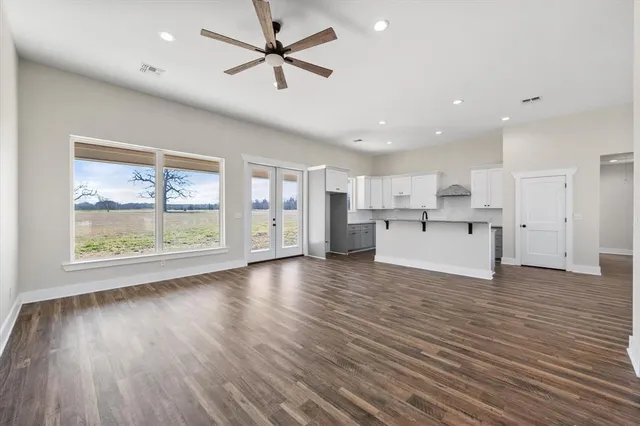 a view of a kitchen with a sink and a window