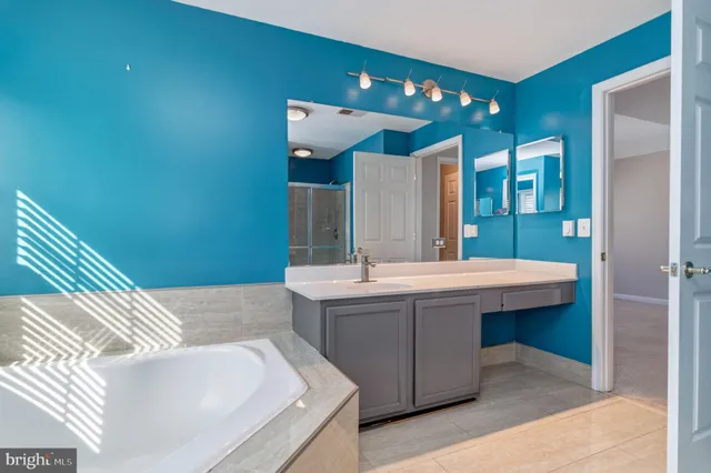 a bathroom with a sink and mirror