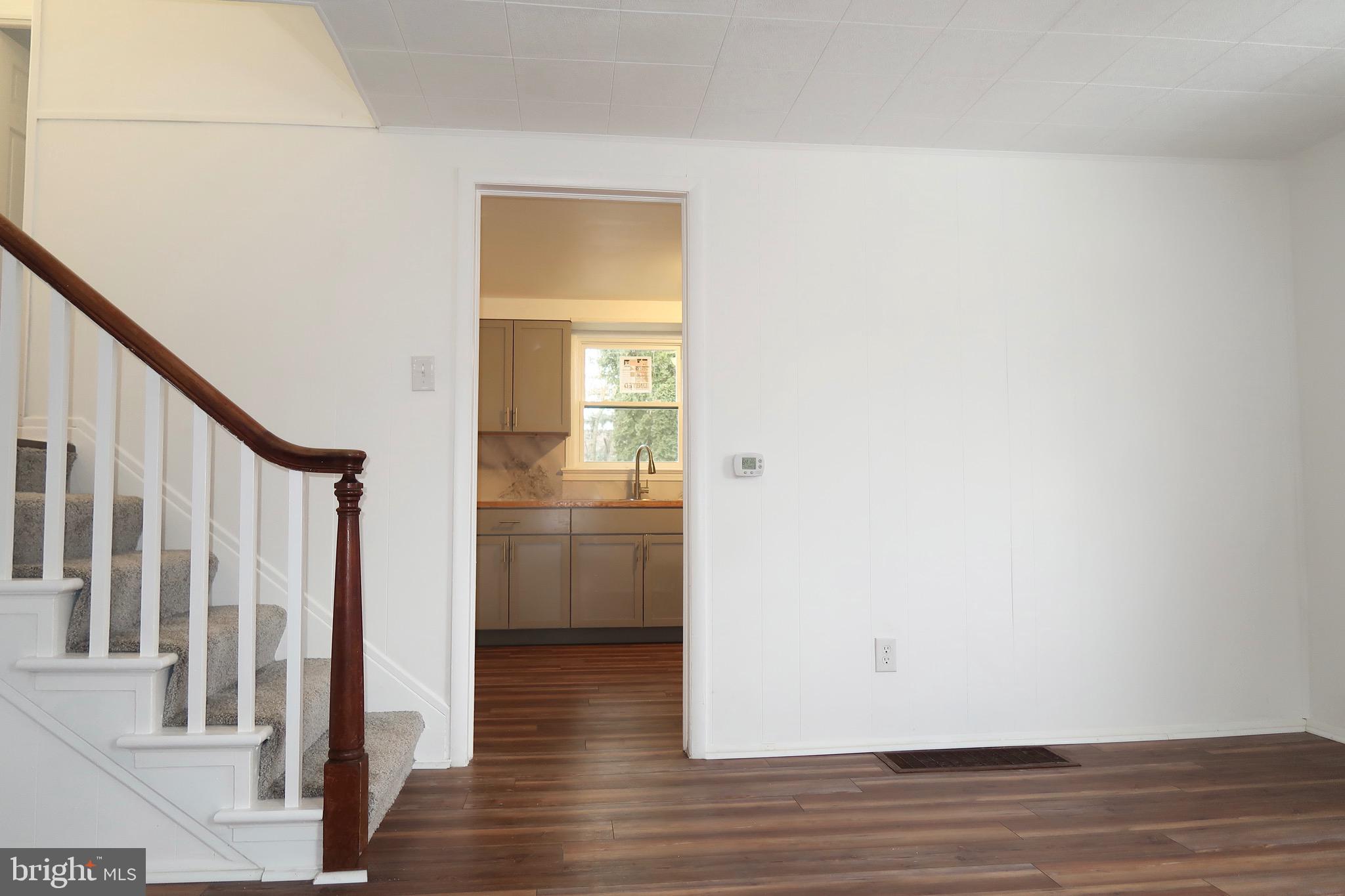 750 Oatman Street York, PA 17404 - Photo 12 of 33 a view of a hallway with wooden floor and staircase