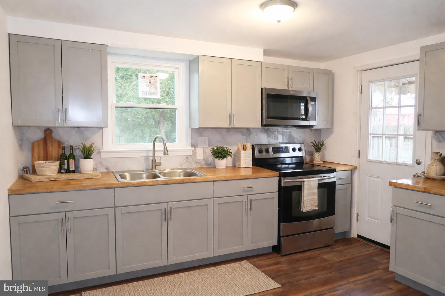 750 Oatman Street York, PA 17404 - Photo 14 of 33 a kitchen with a sink stove and microwave
