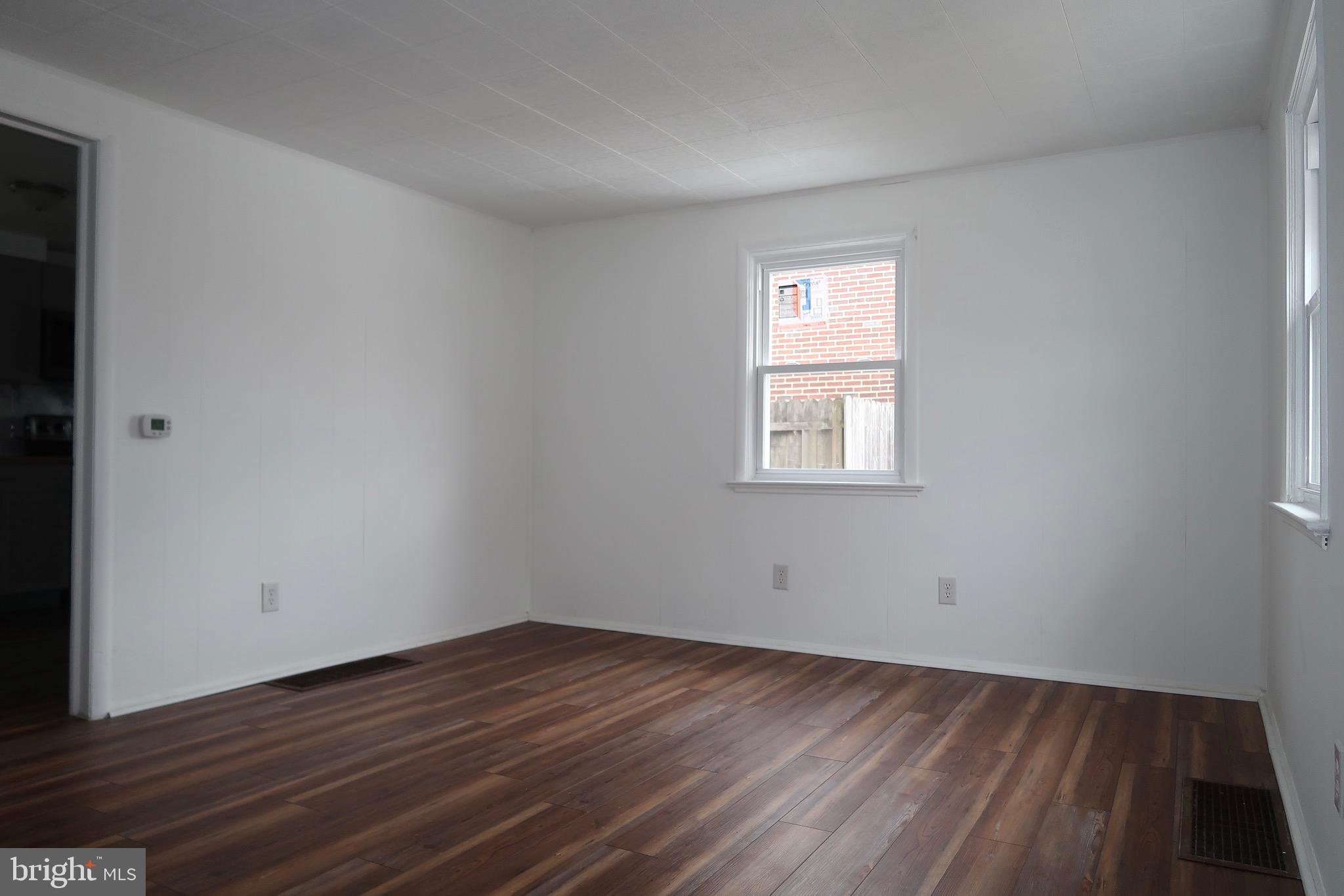 750 Oatman Street York, PA 17404 - Photo 6 of 33 a view of empty room with wooden floor and fan