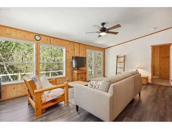 a living room with furniture and a large window