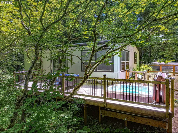 a view of a chairs and table in the backyard