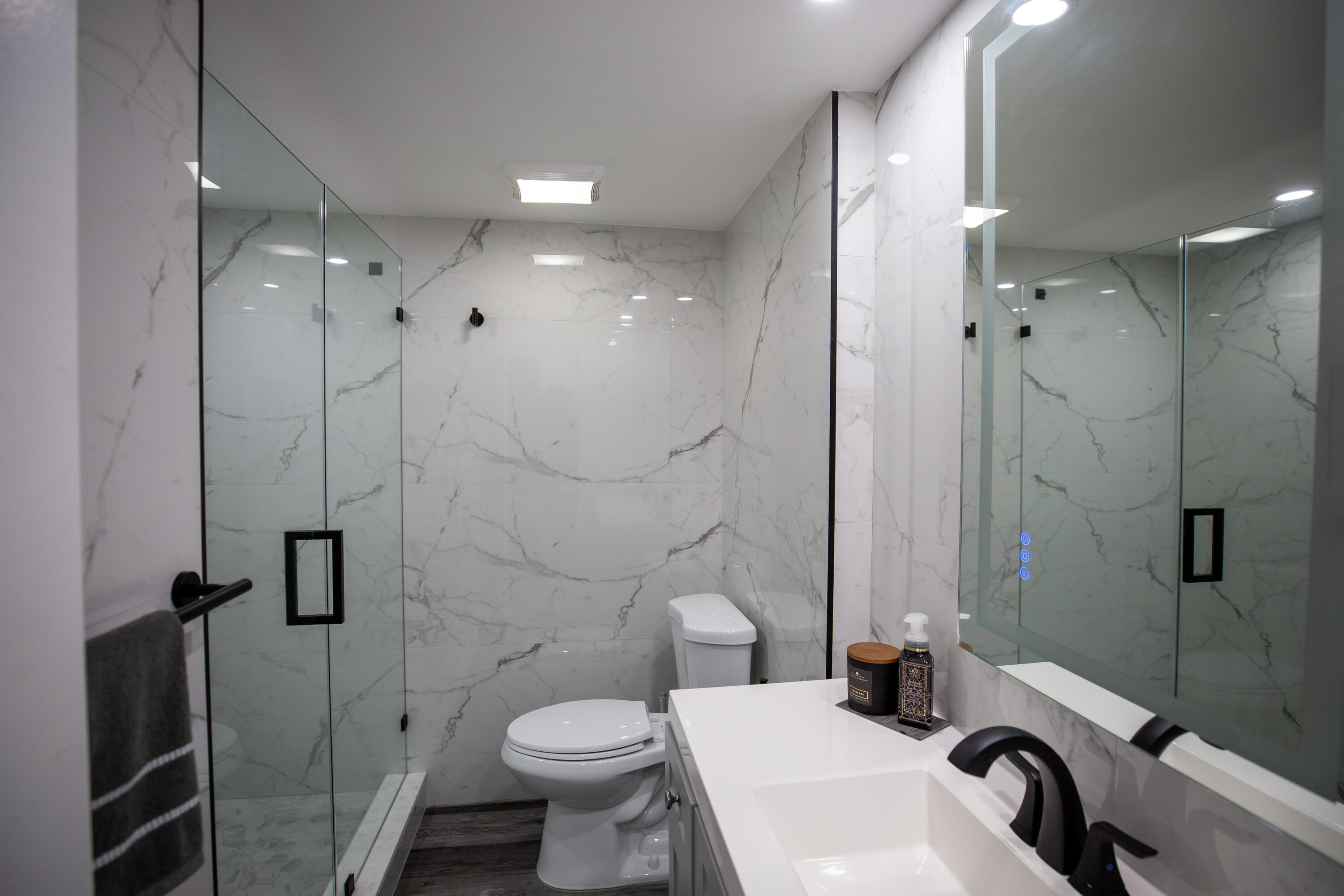 250 Northeast 20th Street, Unit 124S Boca Raton, FL 33431 - Photo 10 of 14 a bathroom with a sink toilet and shower
