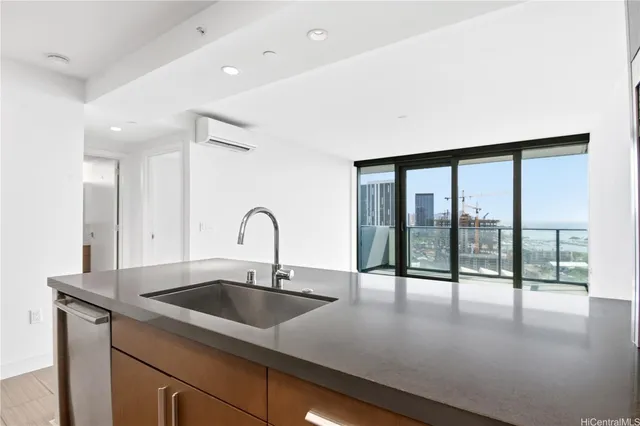 a view of a swimming pool with a lawn chairs and palm trees