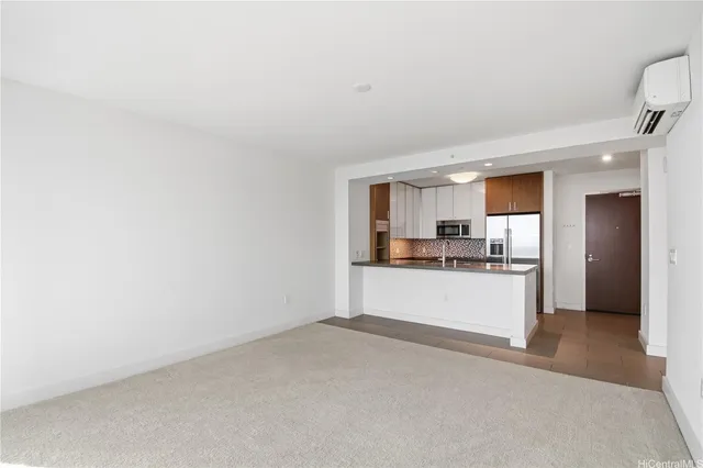 a living room with furniture and large windows