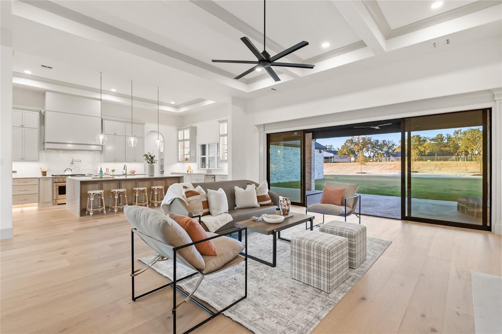 724 Cooper Trail Weatherford, TX 76087 - Photo 11 of 40 Living room featuring beamed ceiling, light wood-style flooring, ceiling fan, recessed lighting, and a tray ceiling