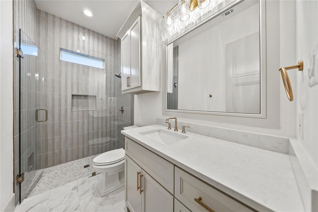 724 Cooper Trail Weatherford, TX 76087 - Photo 20 of 40 Bathroom with vanity, a shower stall, light marble finish flooring, and recessed lighting