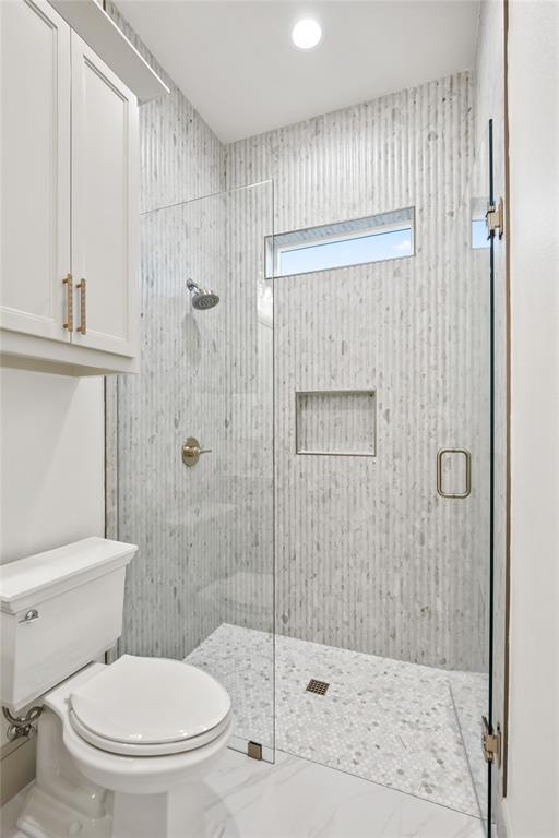 724 Cooper Trail Weatherford, TX 76087 - Photo 21 of 40 Full bathroom featuring a stall shower, recessed lighting, and marble finish floors