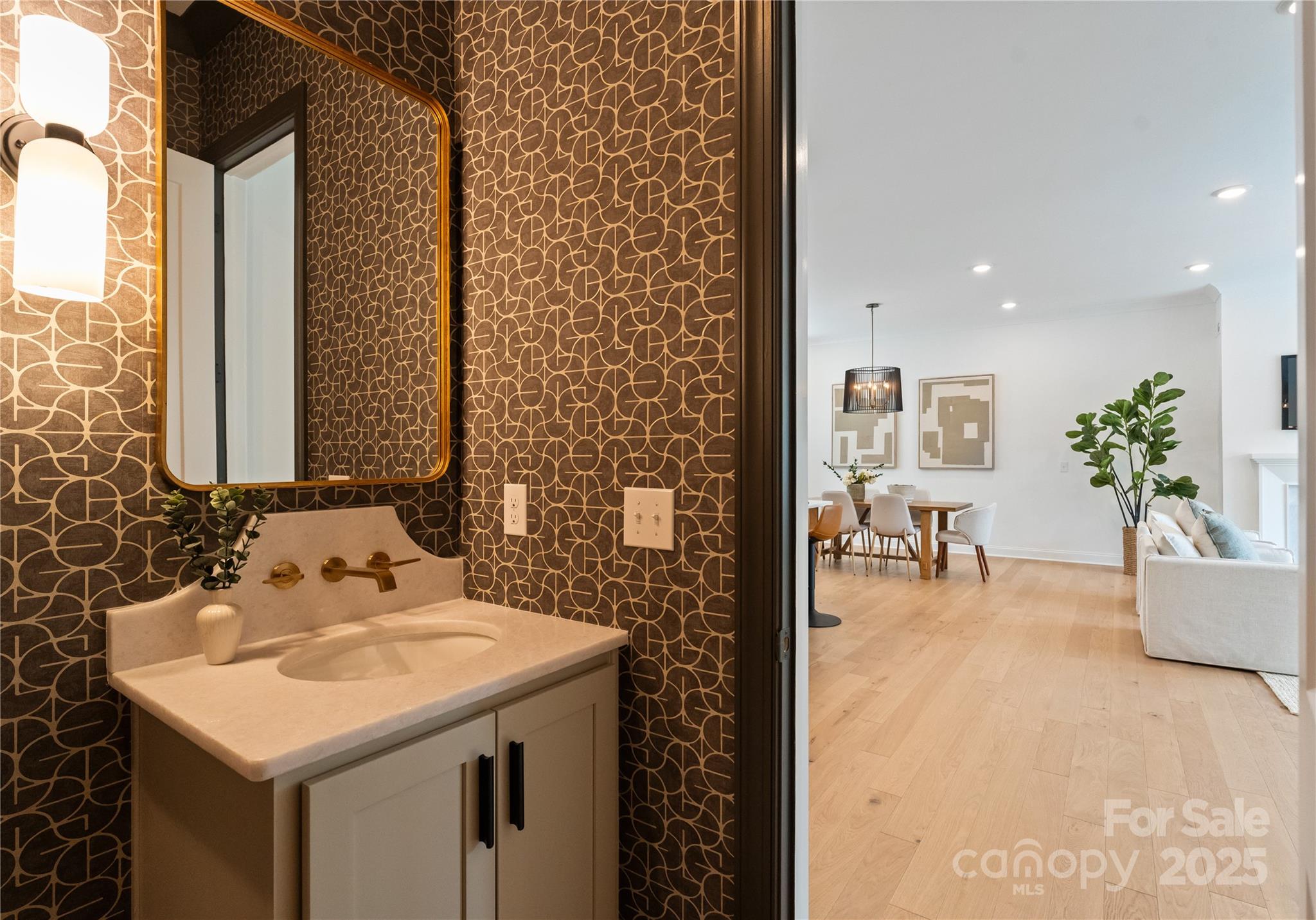 4215 Walker Road Charlotte, NC 28211 - Photo 17 of 43 a bathroom with a sink a potted plant and a shower