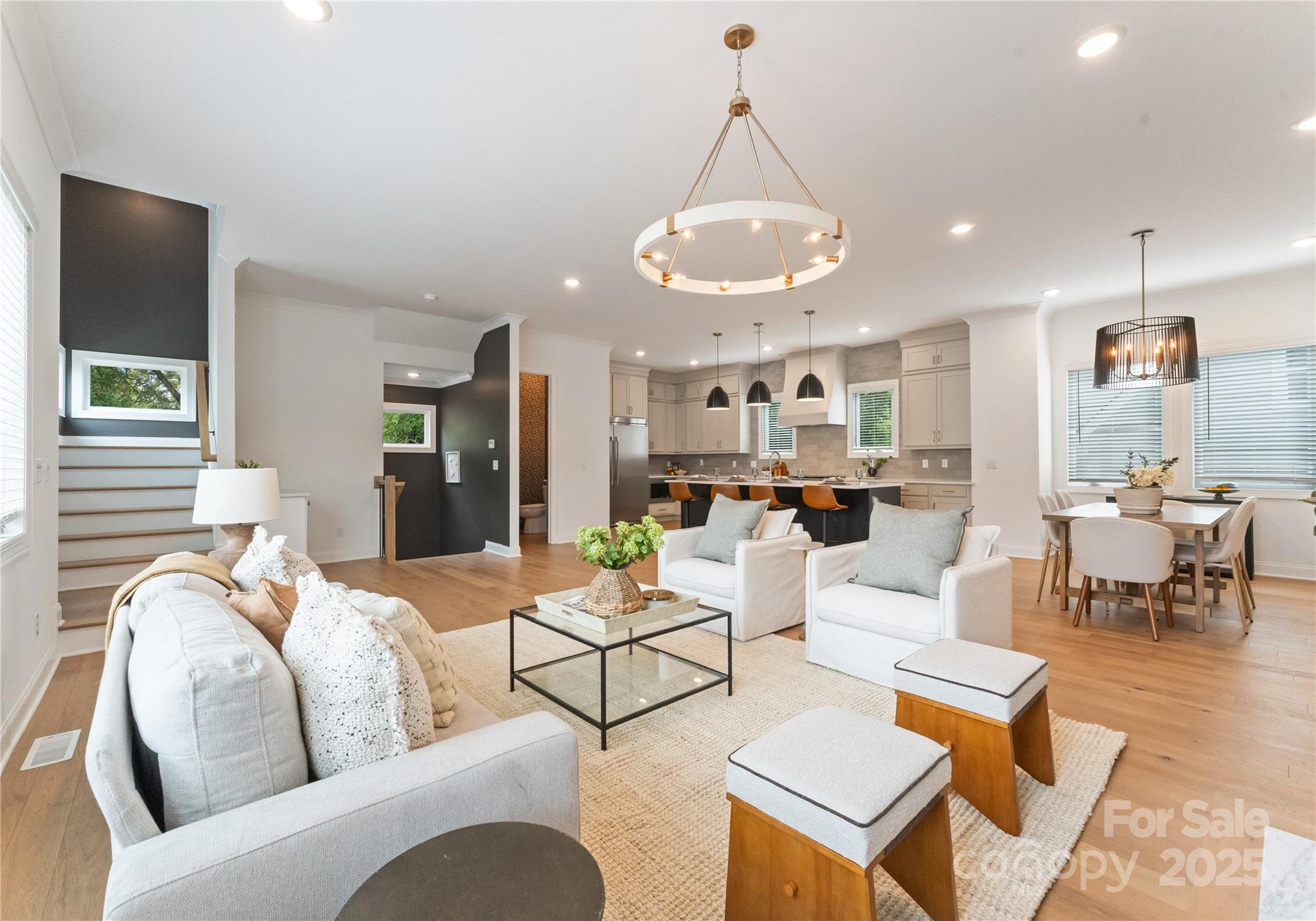 4215 Walker Road Charlotte, NC 28211 - Photo 6 of 43 a living room with furniture kitchen view and a chandelier