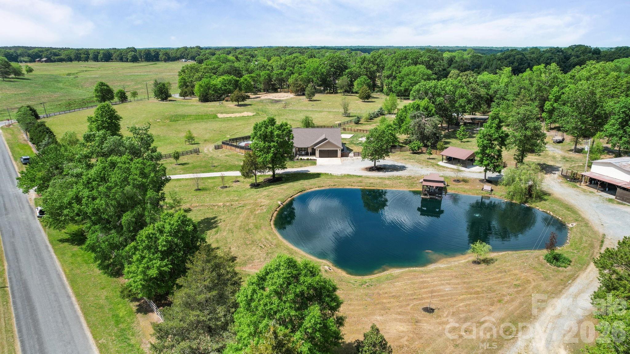 5311 Flint Ridge Marshville, NC 28103 - Photo 1 of 38 a view of a swimming pool with a yard