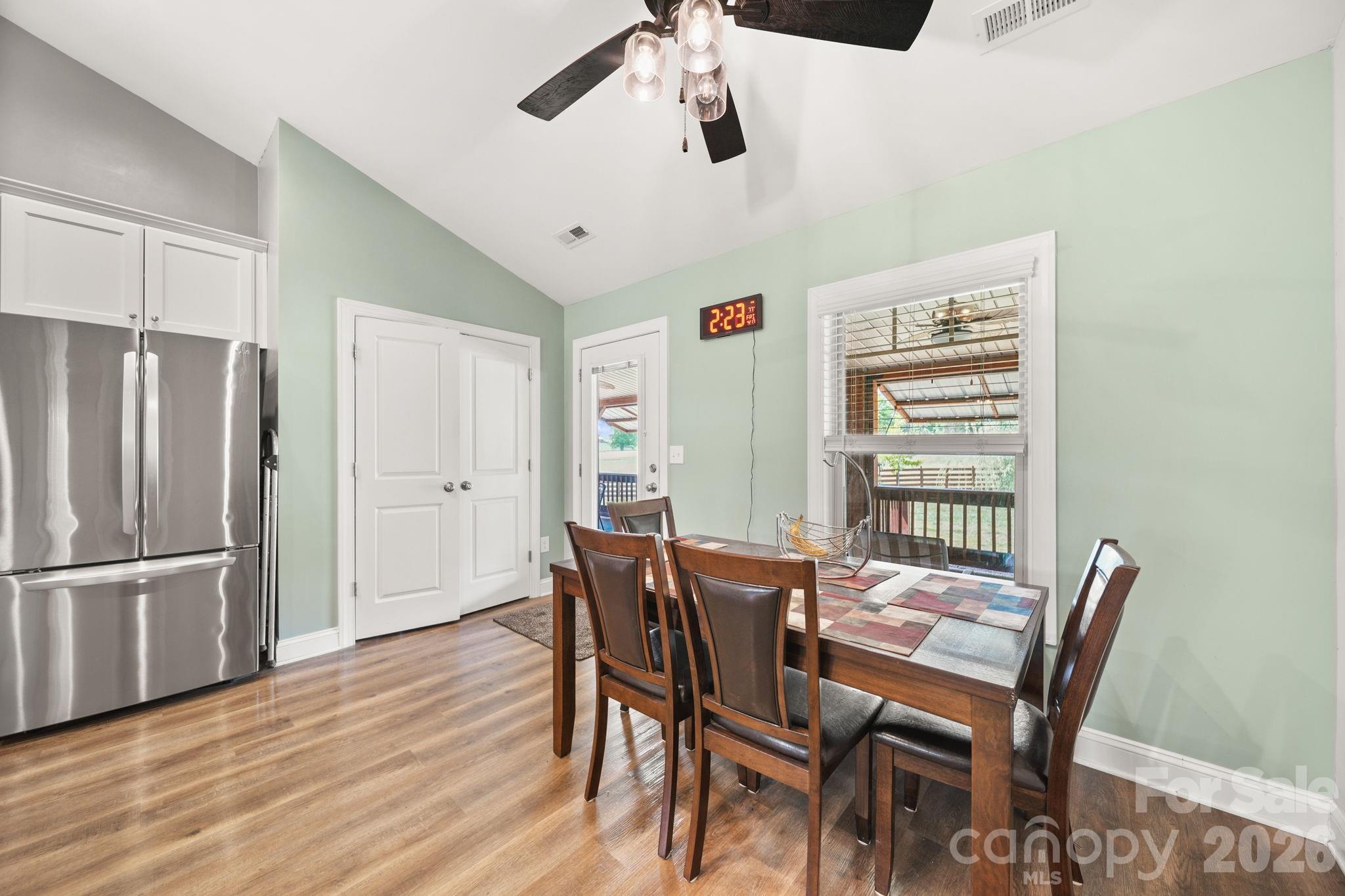 5311 Flint Ridge Marshville, NC 28103 - Photo 12 of 38 a view of a dining room with furniture window and wooden floor