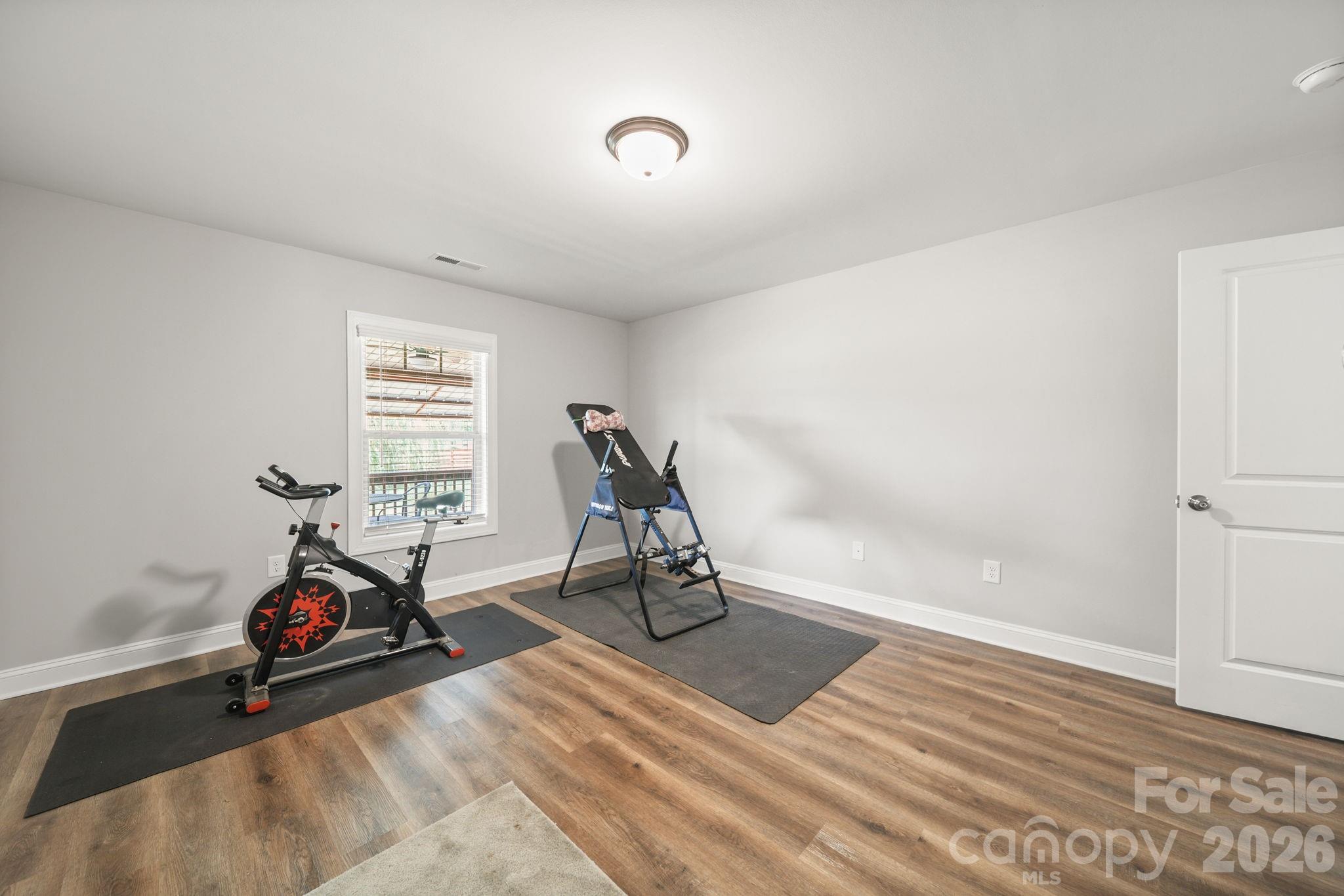 5311 Flint Ridge Marshville, NC 28103 - Photo 19 of 38 a view of a room with gym equipment