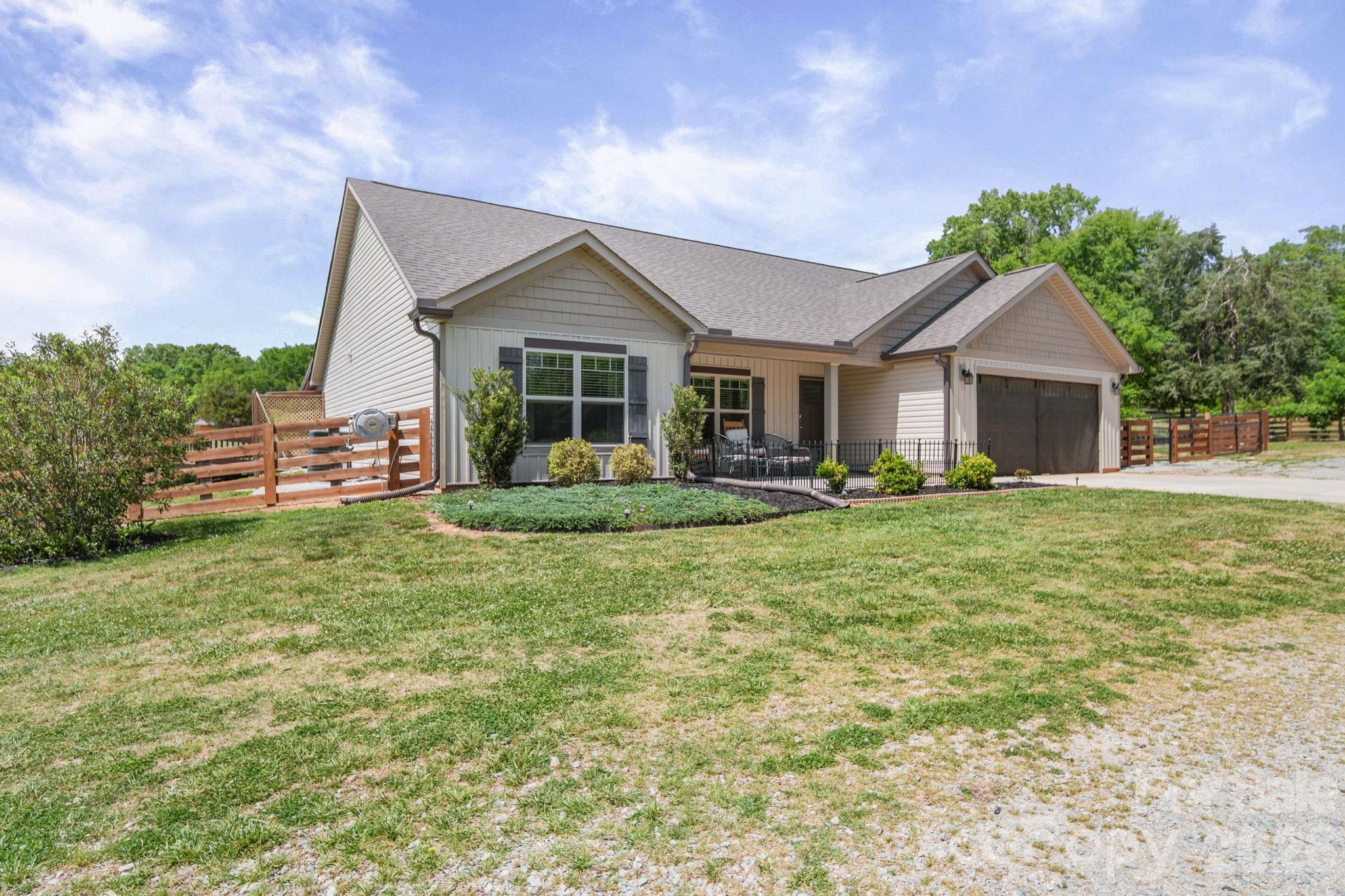 5311 Flint Ridge Marshville, NC 28103 - Photo 3 of 38 a front view of a house with garden