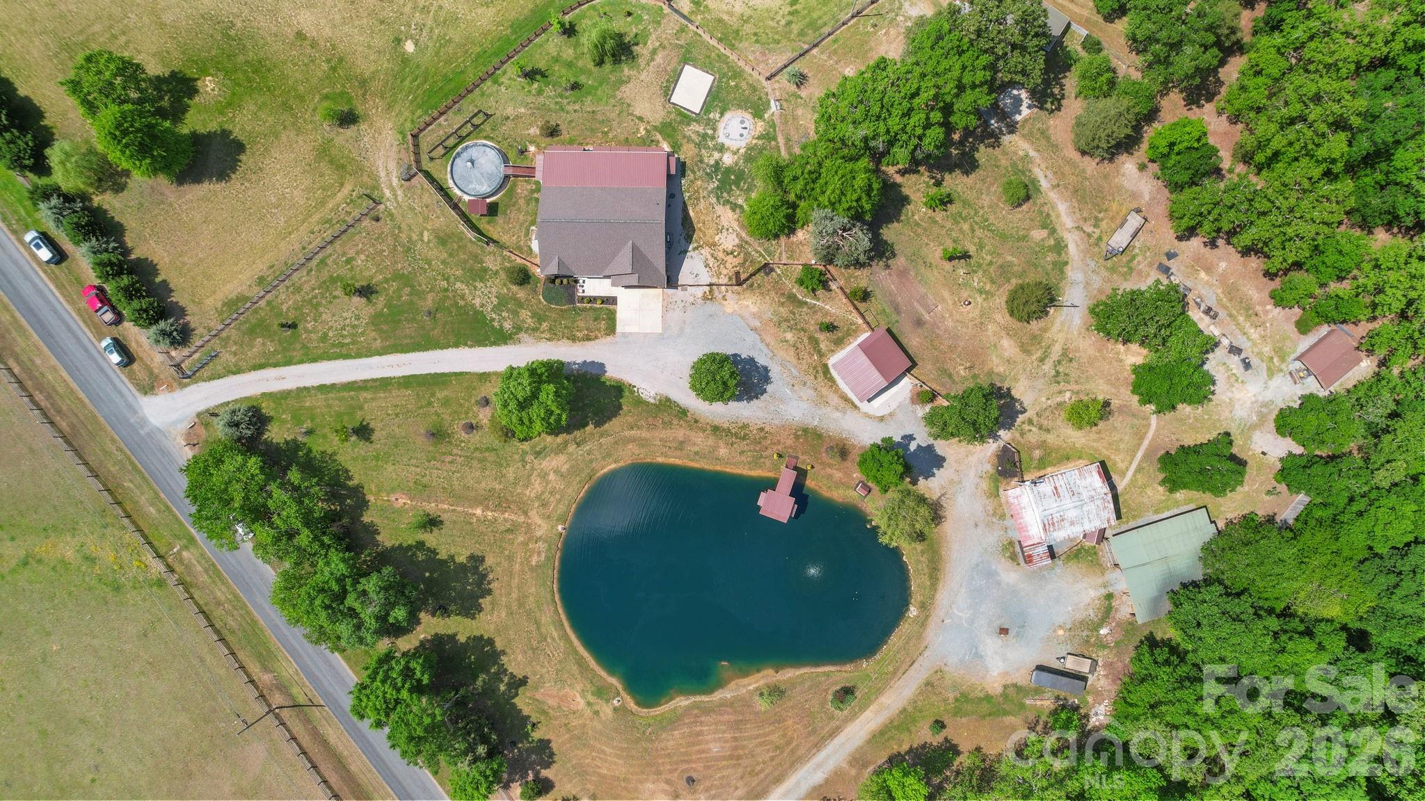 5311 Flint Ridge Marshville, NC 28103 - Photo 36 of 38 an aerial view of a house with a swimming pool and garden