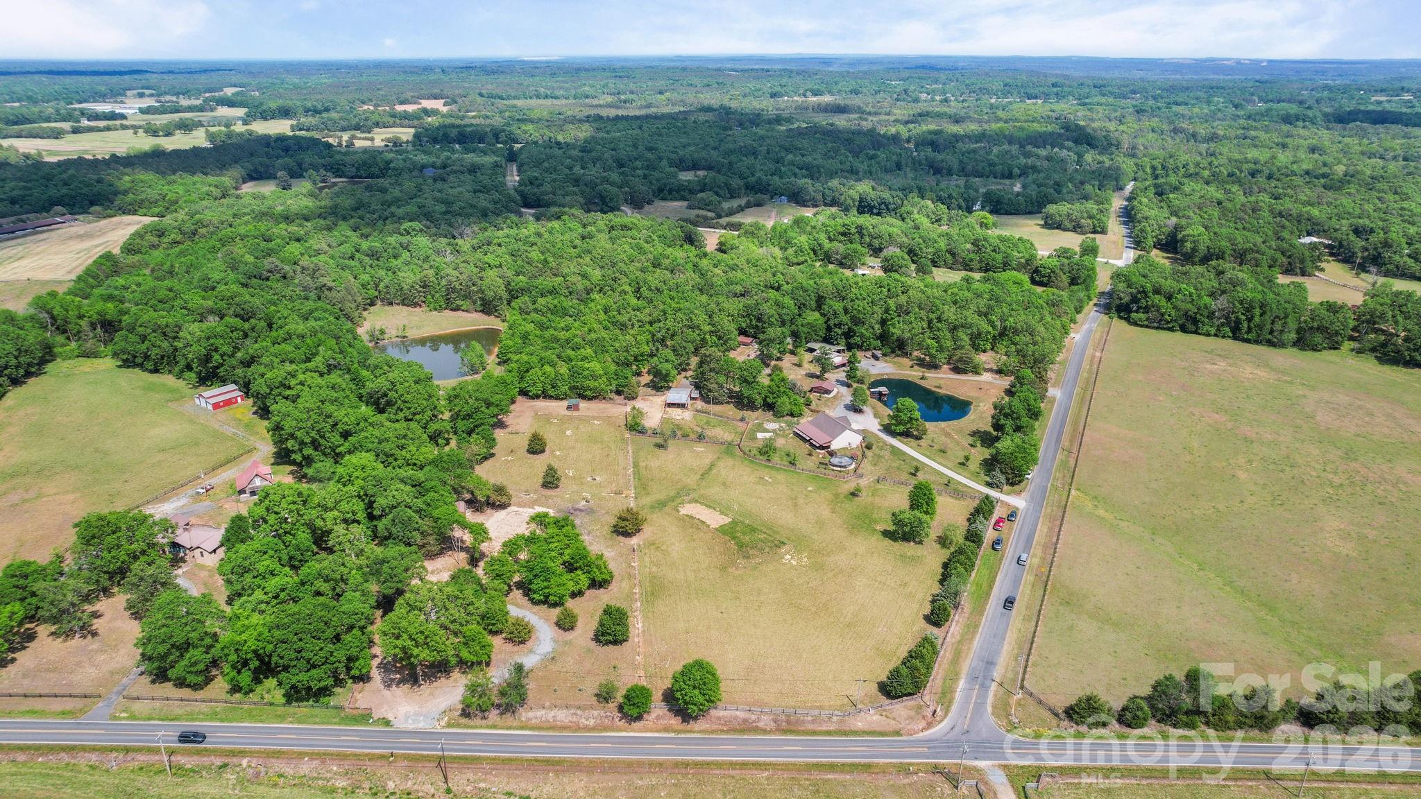 5311 Flint Ridge Marshville, NC 28103 - Photo 38 of 38 an aerial view of a residential houses with outdoor space and trees