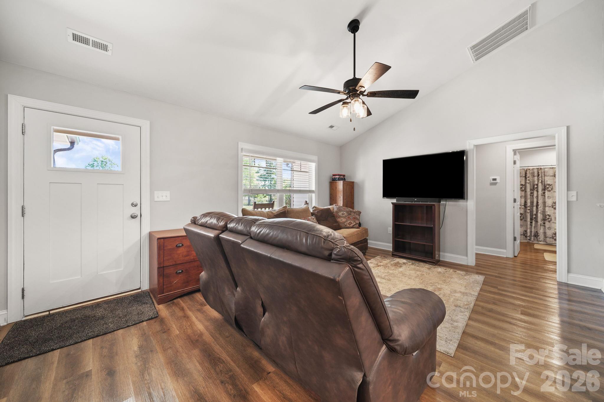 5311 Flint Ridge Marshville, NC 28103 - Photo 5 of 38 a living room with furniture and a flat screen tv
