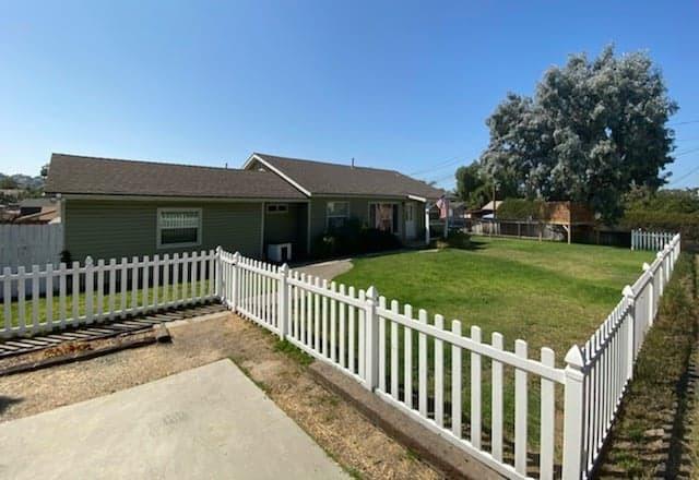 9035 Rosedale Drive Spring Valley, CA 91977 - Photo 1 of 14 a view of a house with backyard and fence