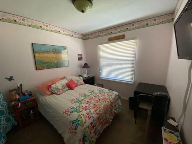 9035 Rosedale Drive Spring Valley, CA 91977 - Photo 11 of 14 a bedroom with a bed and a window