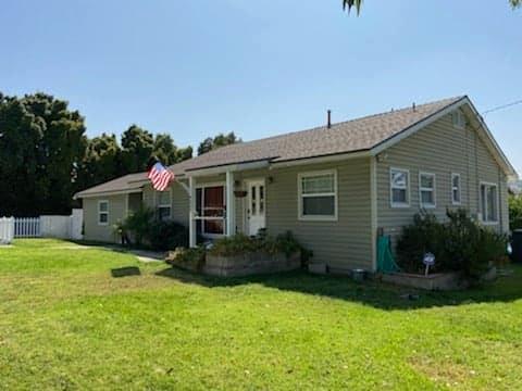 9035 Rosedale Drive Spring Valley, CA 91977 - Photo 4 of 14 a view of a house with backyard and garden