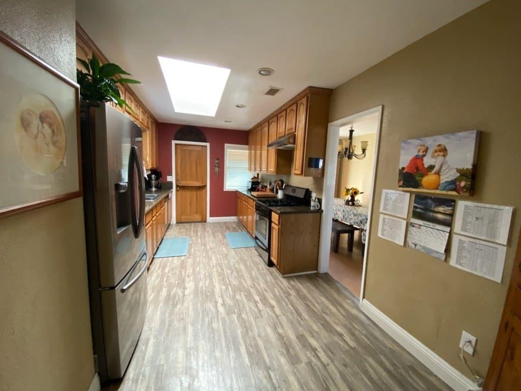 9035 Rosedale Drive Spring Valley, CA 91977 - Photo 7 of 14 a view of a kitchen with furniture and wooden floor
