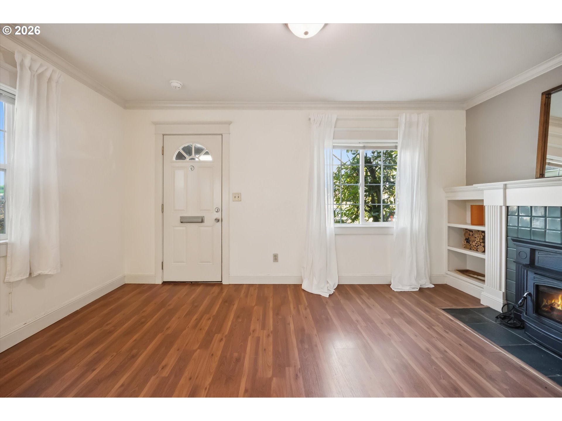 6118 Northeast Alton Street Portland, OR 97213 - Photo 11 of 46 wooden floor in an empty room with a window