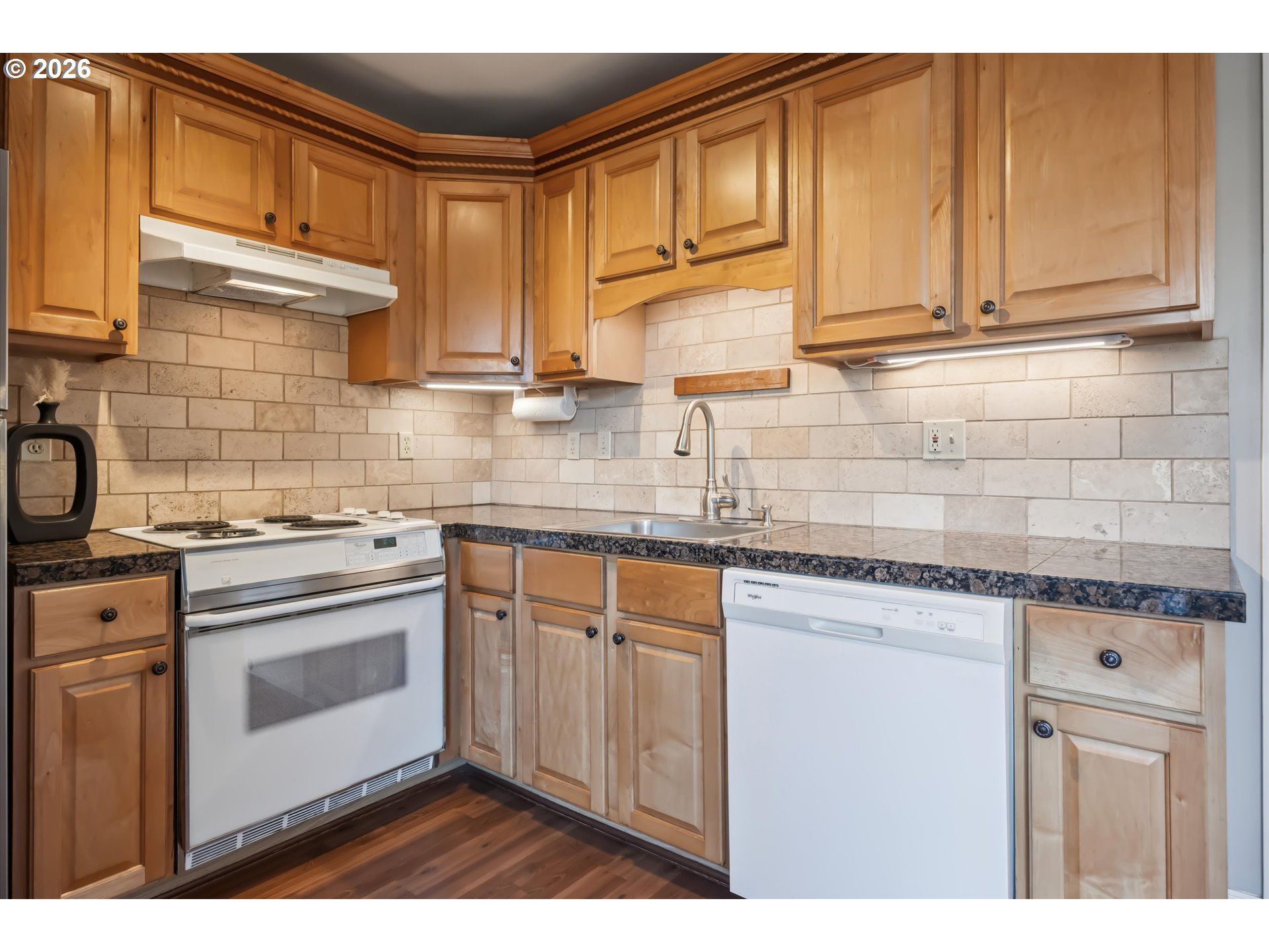 6118 Northeast Alton Street Portland, OR 97213 - Photo 17 of 46 a kitchen with stainless steel appliances granite countertop a sink stove and cabinets