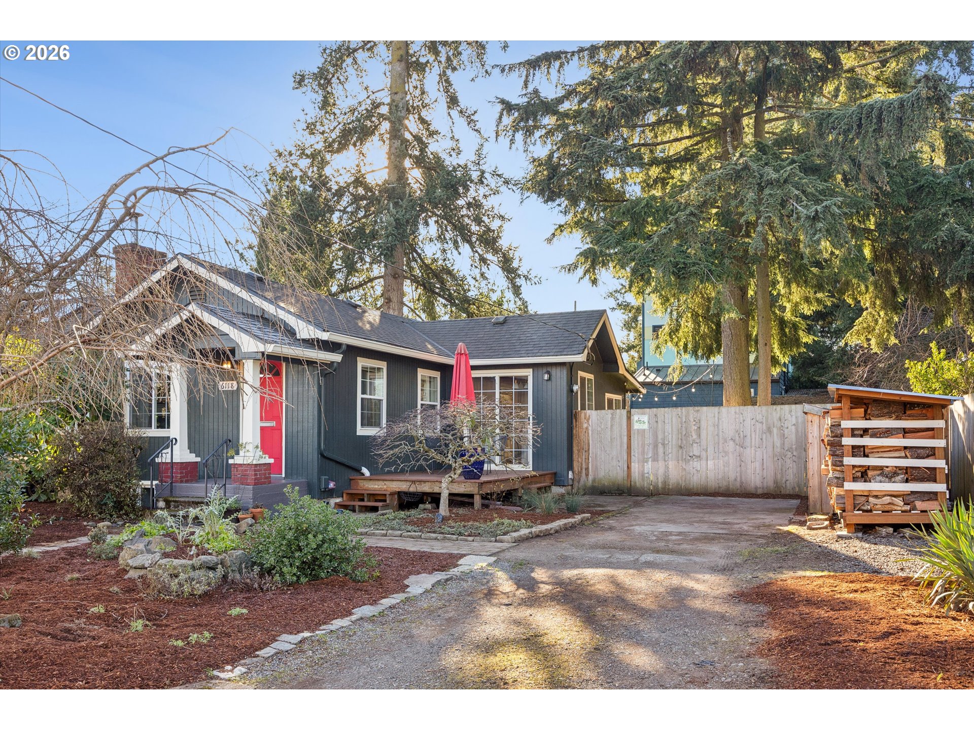 6118 Northeast Alton Street Portland, OR 97213 - Photo 2 of 46 a front view of a house with a yard