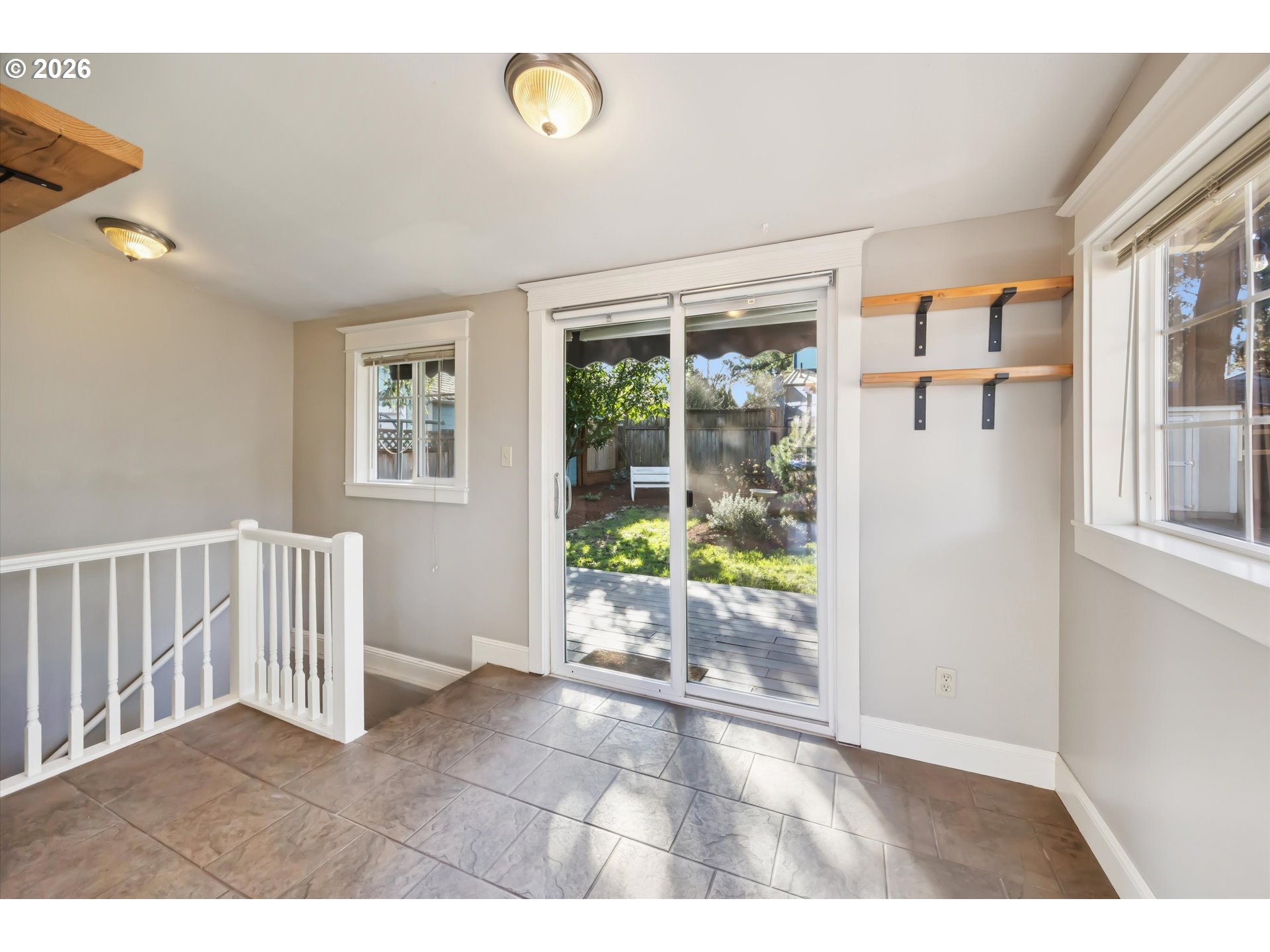 6118 Northeast Alton Street Portland, OR 97213 - Photo 23 of 46 a view interior of a house with wooden floor and windows
