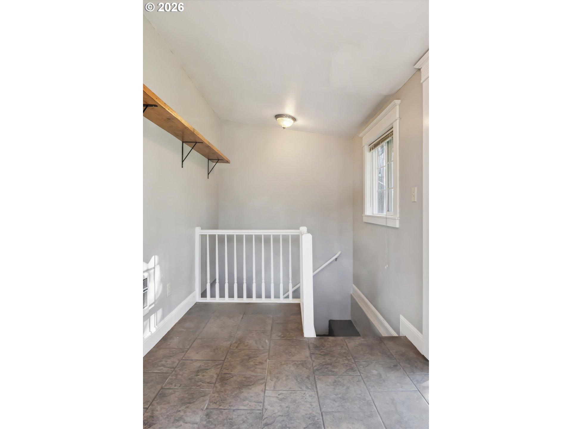 6118 Northeast Alton Street Portland, OR 97213 - Photo 27 of 46 a view of a hallway with stairs