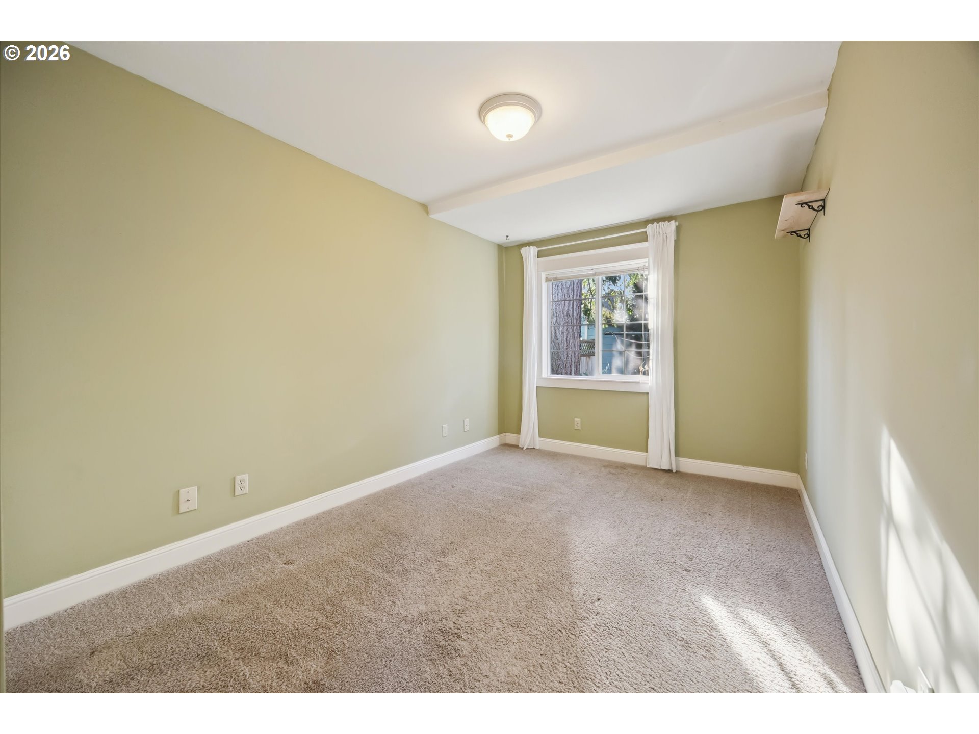 6118 Northeast Alton Street Portland, OR 97213 - Photo 28 of 46 a view of an empty room with a window