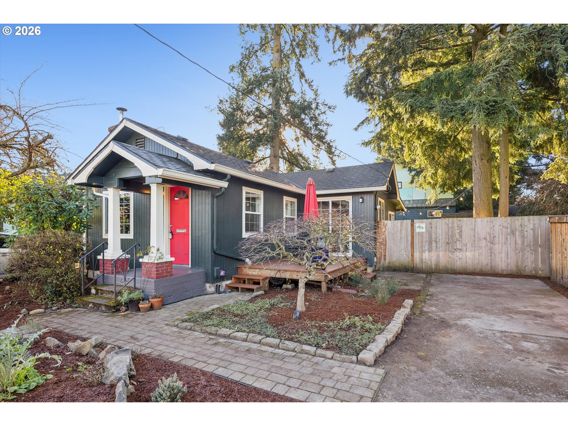 6118 Northeast Alton Street Portland, OR 97213 - Photo 3 of 46 a backyard of a house with table and chairs