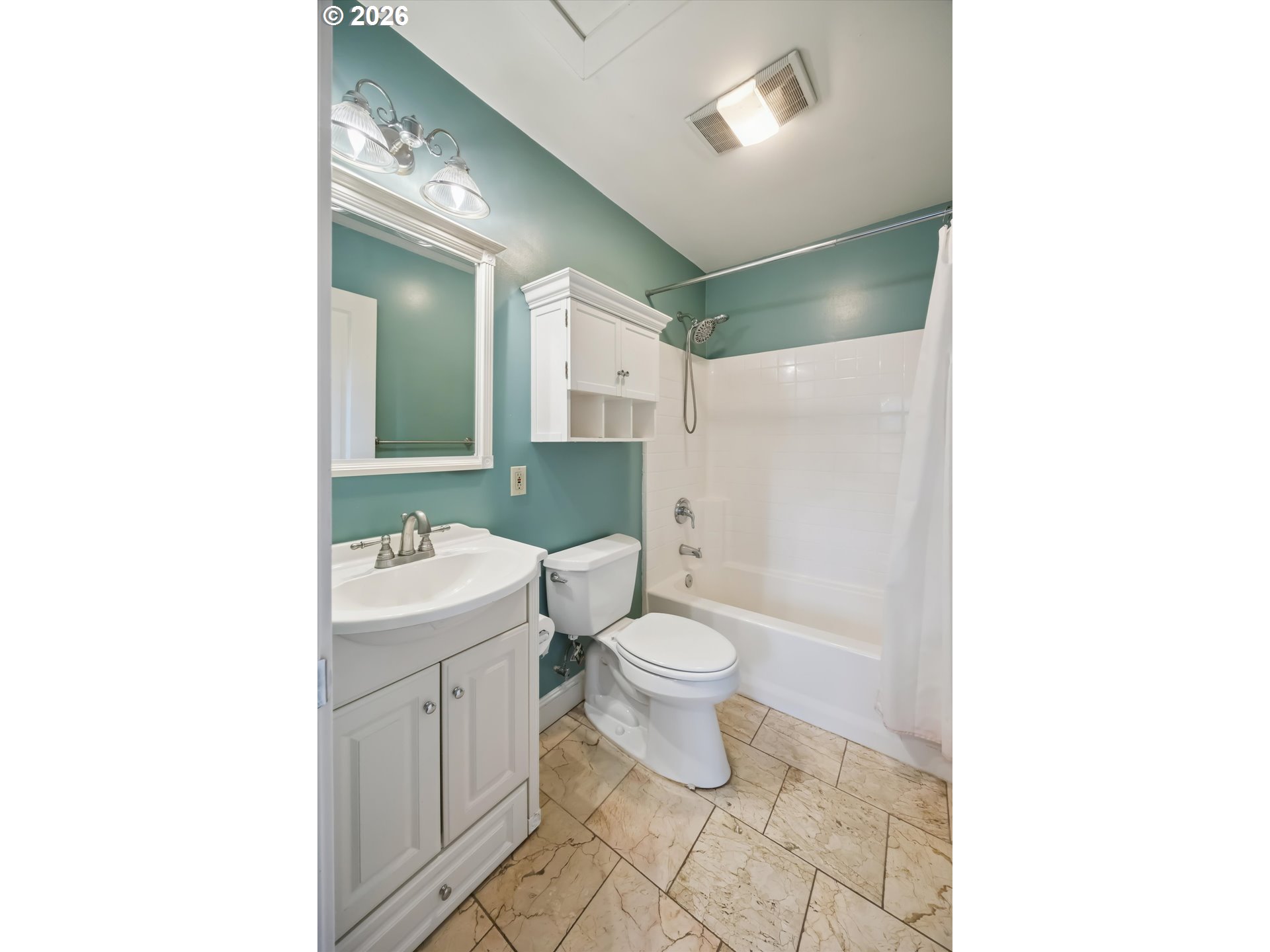 6118 Northeast Alton Street Portland, OR 97213 - Photo 31 of 46 a bathroom with a toilet a sink and mirror