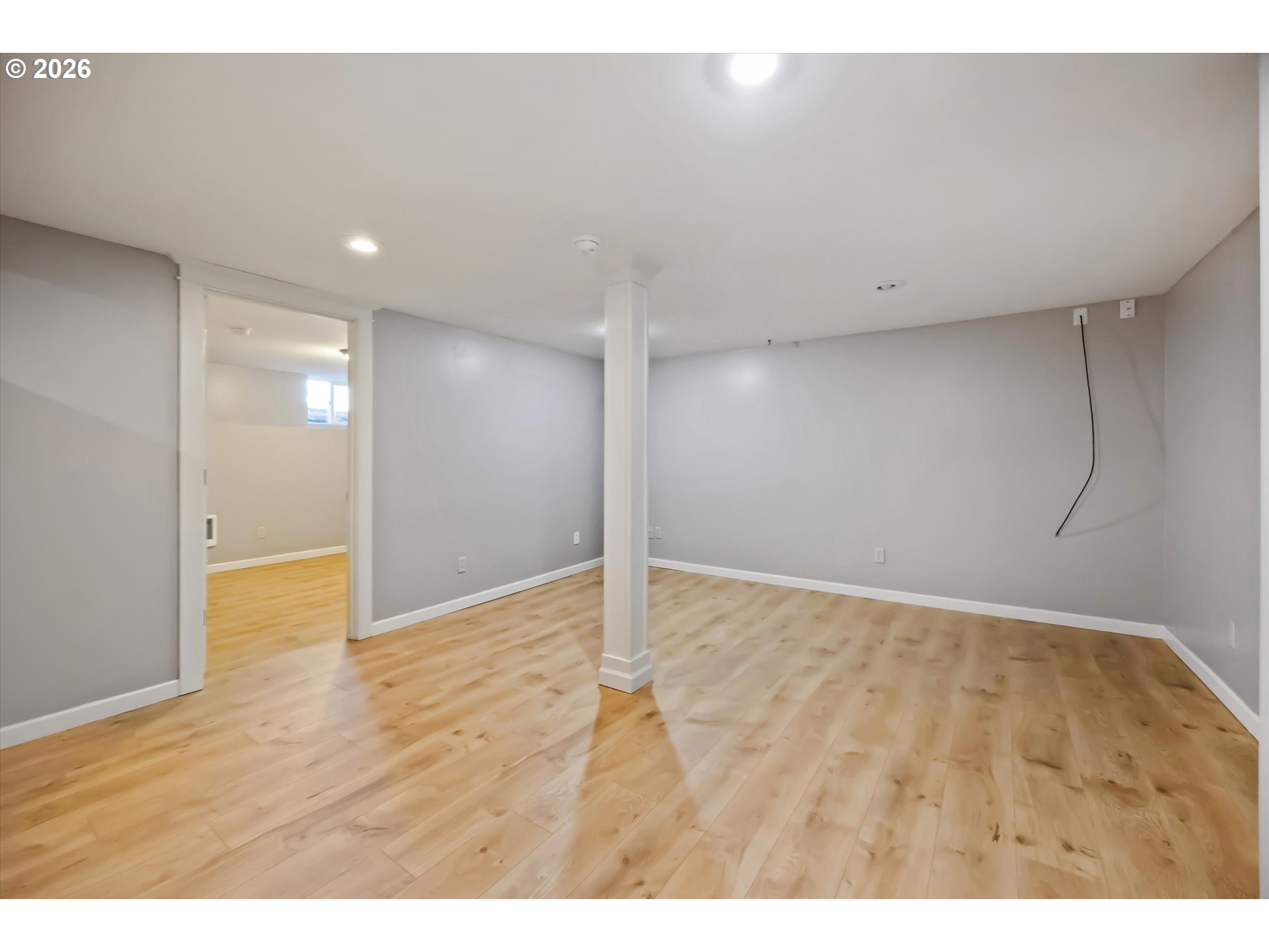 6118 Northeast Alton Street Portland, OR 97213 - Photo 33 of 46 a view of an empty room with wooden floor