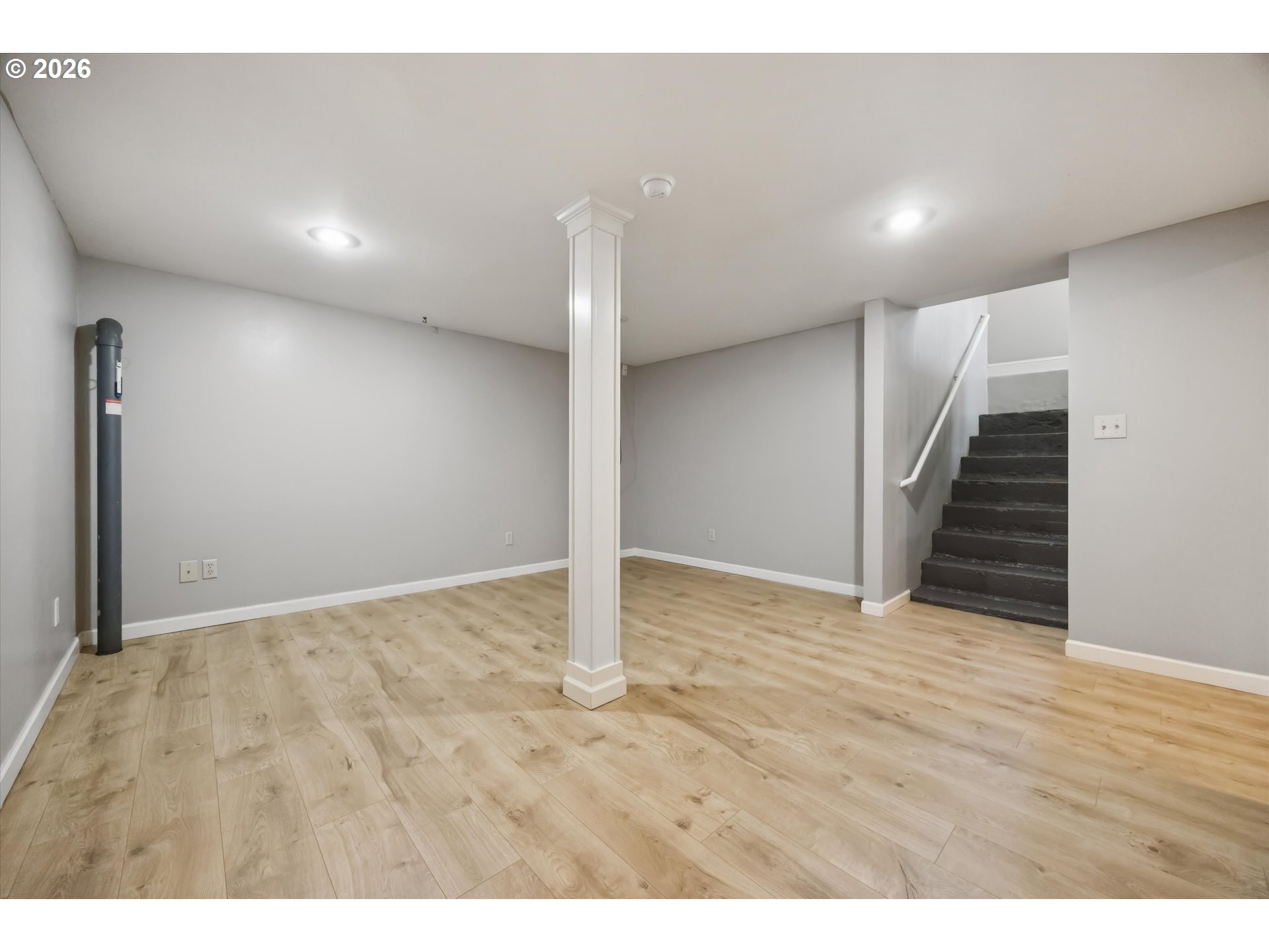 6118 Northeast Alton Street Portland, OR 97213 - Photo 34 of 46 a view of an empty room with wooden floor