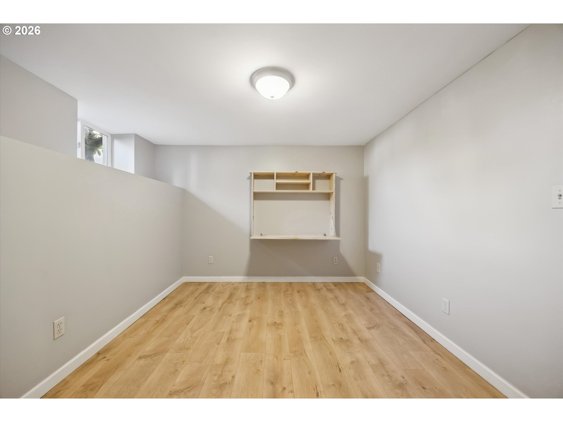 6118 Northeast Alton Street Portland, OR 97213 - Photo 37 of 46 a view of empty room with wooden floor