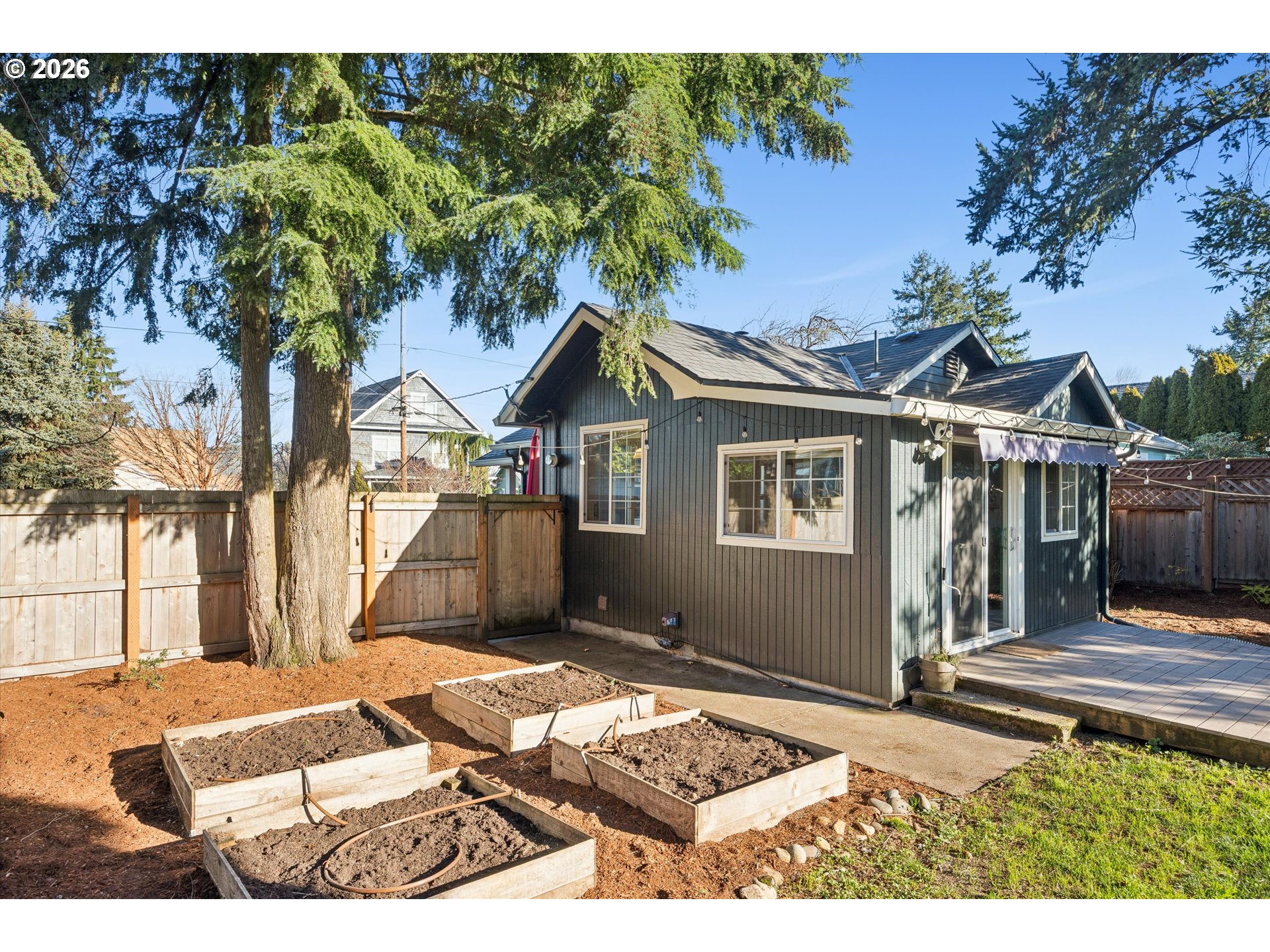 6118 Northeast Alton Street Portland, OR 97213 - Photo 44 of 46 a front view of a house with a yard