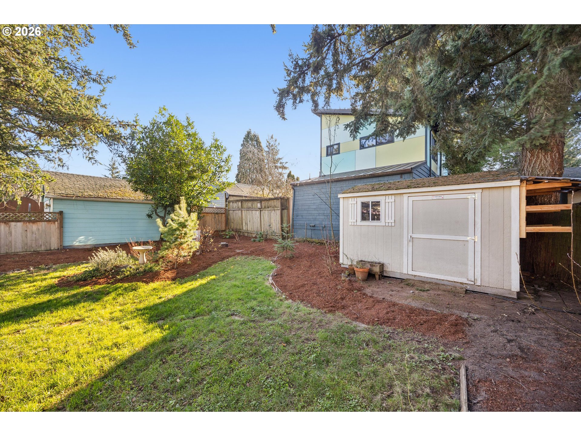 6118 Northeast Alton Street Portland, OR 97213 - Photo 45 of 46 a view of a house with backyard and a tree