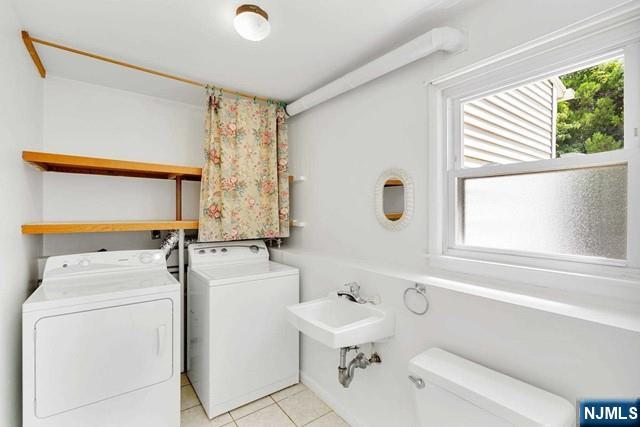 516 Knickerbocker Road Cresskill, NJ 07626 - Photo 22 of 31 a bathroom with a sink a toilet and tub
